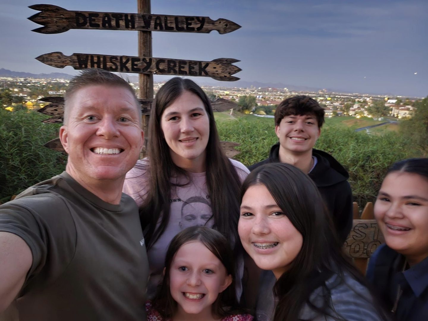 "Patterson Roofing LLC family owners with English Cream Retrievers and Corgi"